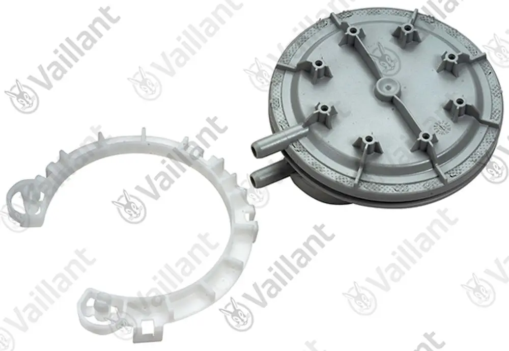Vaillant Druckwächter mit einer runden grauen Komponente und einem weißen Ring, der zur Montage oder Verbindung dient. Zwei Rohre sind an der grauen Komponente angebracht.